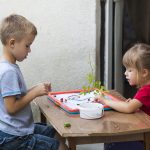 Children boy and girl playing together